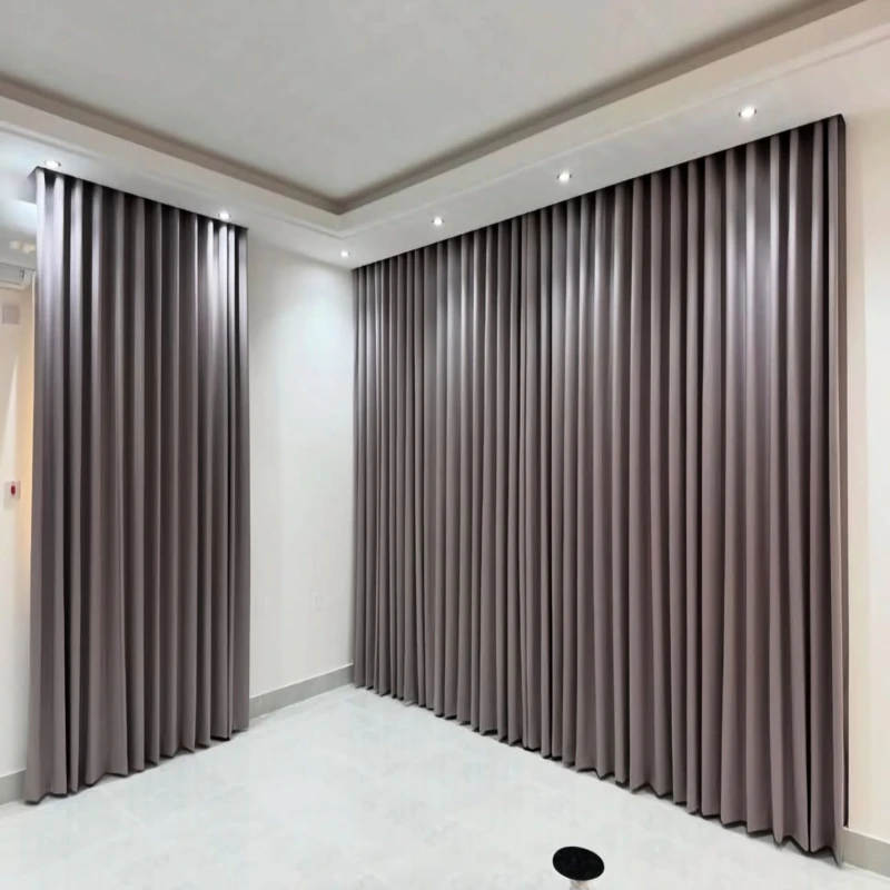 Completed commercial blackout curtain project with floor-to-ceiling panels