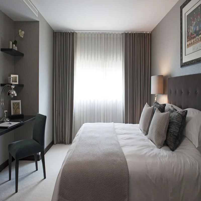 Elegant curtain panels in serviced apartment bedroom